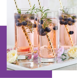 Mocktail beverages with blueberries and rosemary garnish.